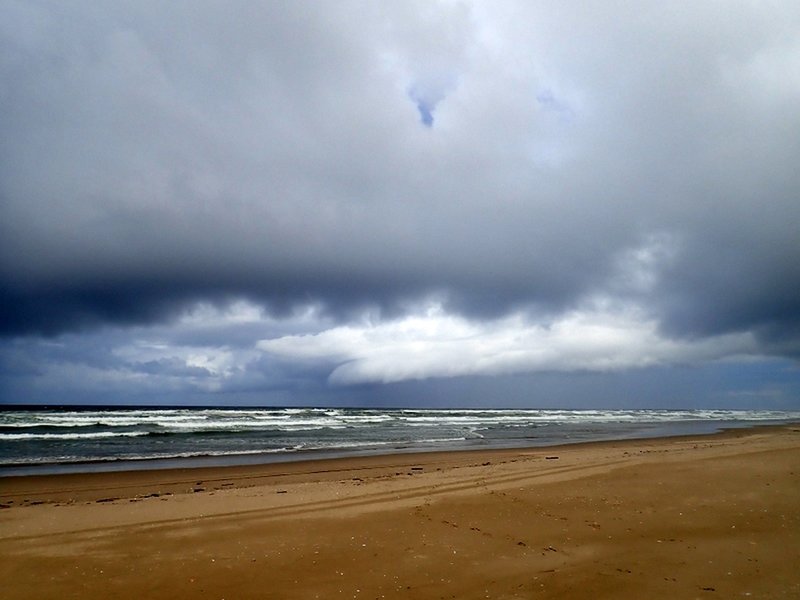 A summer storm approaches the shore