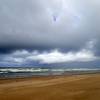 A summer storm approaches the shore