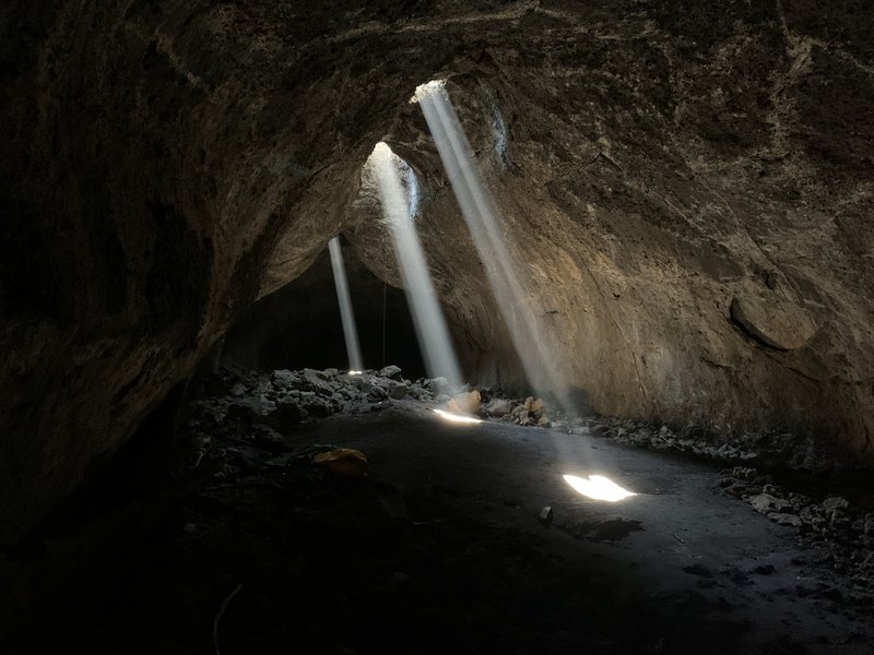 The three stunning sunbeams in Sky Light Cave.