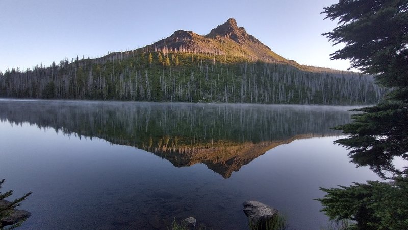 Duffy Butte reflected in the lake.