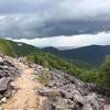 Trail curving around talus slope at Blackrock Mountain summit area.