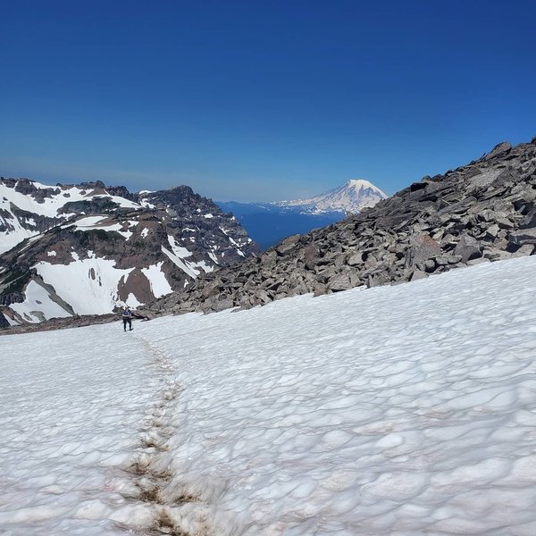 Crossing the last of the summer snow before heading to the accent of Old Snowy Mountain.