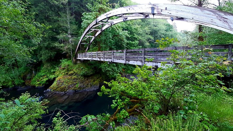 Diamond Mill Footbridge over the Wilson River, a wooden arch suspension bridge.