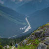 A hiker descends the Hermit Trail towards the Roger's Pass.