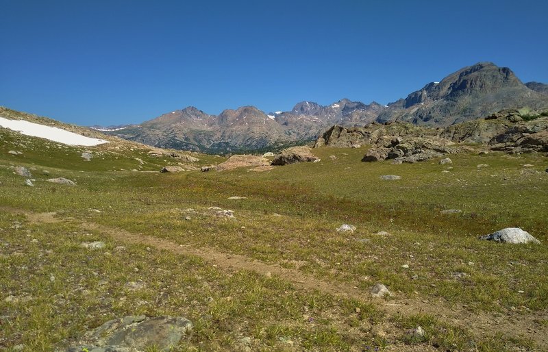 The view to the north from the north side of the Mt. Baldy pass at Bald Mountain Basin's south end. Mountains left to right - Mt. Lester's two peaks, distant mountains defining Titcomb Basin, and unnamed ridge of peaks.