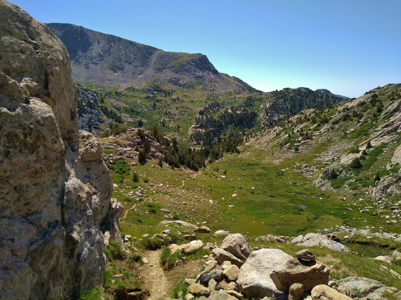 The CDT/Fremont Trail drops quickly into a breath-taking valley to the south of the Mt. Baldy pass at the Bald Mountain Basin southern end.