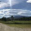 Cascading clouds over the mountain peaks.