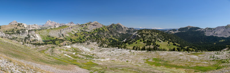 Vista across southern Grand Teton National Park from Game Creek Pass. Housetop Mountain and Grand Teton on the left, Mount Hunt and Rendezvous Mountain towards the right.