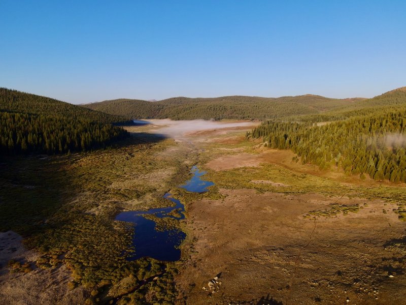 Drone footage of the morning fog over the marshland about 7 miles in. Trail can be seen to the right.