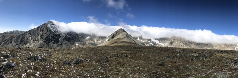 Panorama of clouds rolling over the ridge.