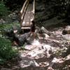 Small bridge over water stream about one mile from pinwheel mailbox.