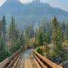 Mountains rising above the creek on a smoky day.