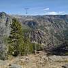 The view from Crows Nest Lookout looking east-southeast. Angel Pass is the notch in the far distance just left of center. Angel Peak is on the left side of the pass.