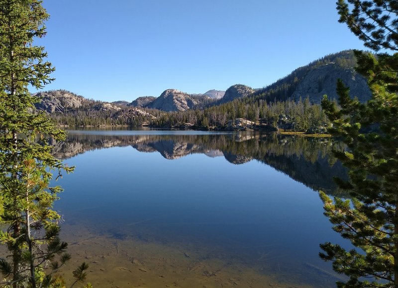 Trapper Lake on a still September morning, as seen from the lake's south end on Summit Lake Trail.