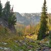 The upper reaches of Pine Creek, just about a half mile from Summit Lake, its source, are in the steep sided valley ahead. The trail, going south, descends to cross the creek and then climb out of the creek valley in the distance.