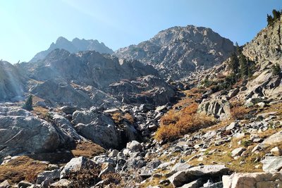 This is the trail through the valley below New York Mountain on the way to New York Lake. You have to cross lots of talus. Trail is sketchy but cairns are well placed. It is a rugged trail with lots of ups and downs.