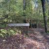 The start of the trillium valley trail. A sign showing what the trail is and where it starts.