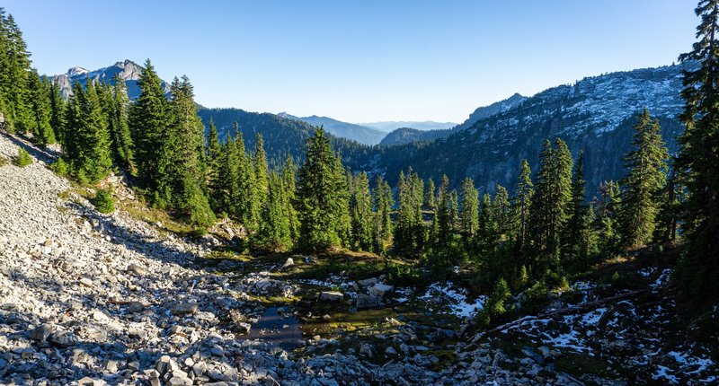 A tarn below Gem Lake, looking out towards Snoqualmie Pass.