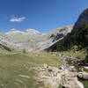 Panoramic view Circo del Soaso (Soaso cirque) with the trail at the left and Rio Arazas at the right