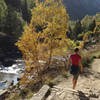 Autumn hiker near Gradas de Soaso (Soaso cascades)