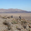 Two hikers descend the ridge back to Canebrake.