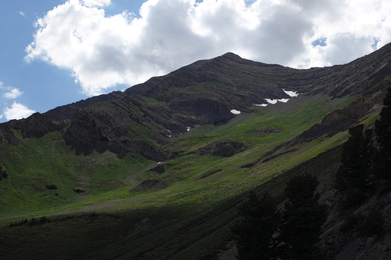 A verdant Mt. Nebo with patches of snow left on it in late July.