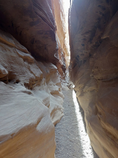 Direct sun shining through a narrow section of Little Wild Horse Canyon
