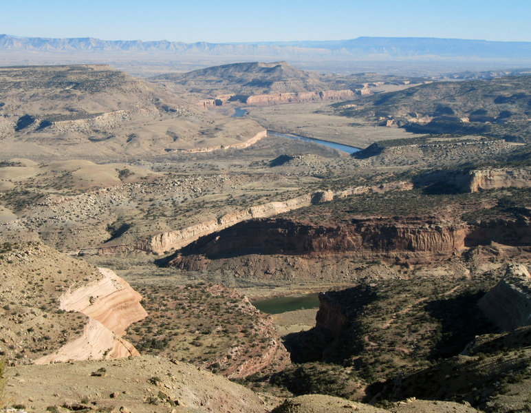 The Colorado River winds its way through the desert sandstone.