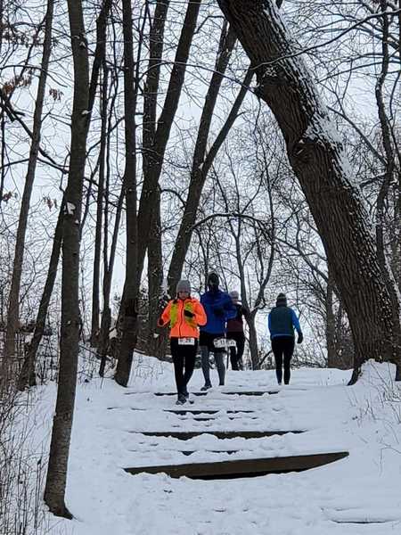 Runners on the stairs enjoying the 8 hour race in winter.