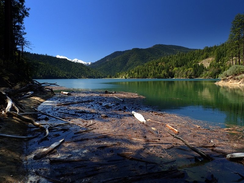 The snowy Red Buttes above a full Applegate Lake,