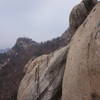 Bukhansan Traverse below Munsubong Peak, at this point I lost my footing on the ice covered rock but I did make a grab for the wire rope while my legs disappeared over the ledge.