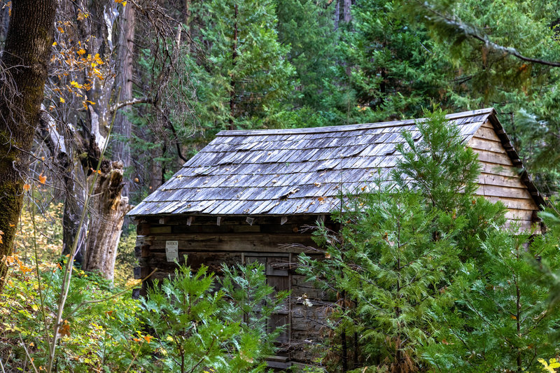 A historic hut next to the American River Trail