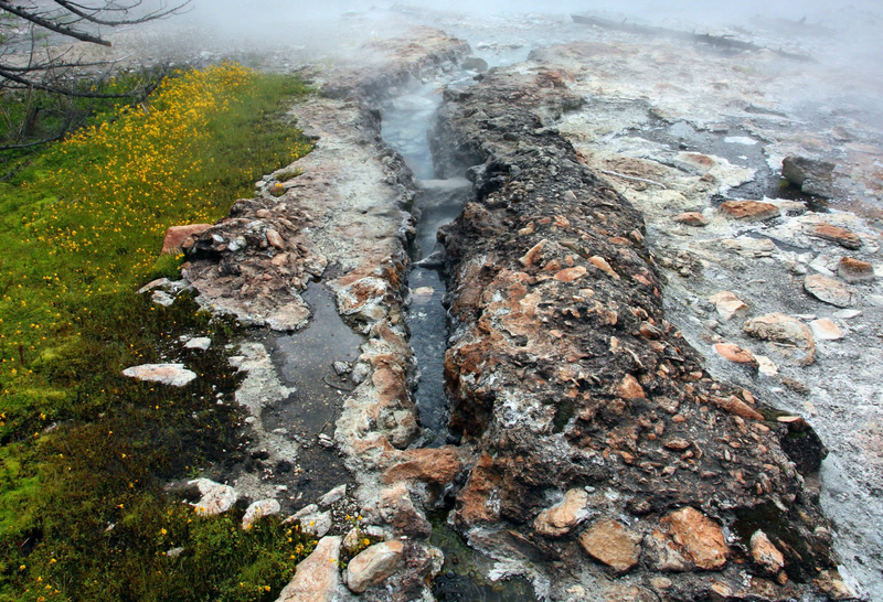 Boiling hot water gushes up out of the depths of Vulcan Hot Spring