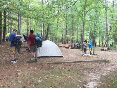 Scout troop setting up camp.