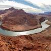 From the top of Spencer Trail overlooking Lee's Ferry with Navajo Bridge and the Vermillion Cliffs in the background.