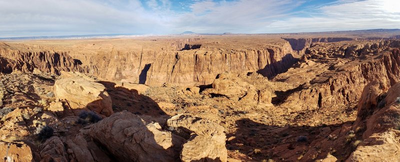 Another view from the summit, this time in the opposite direction looking past Horseshoe Bend with Page, AZ, in the background.