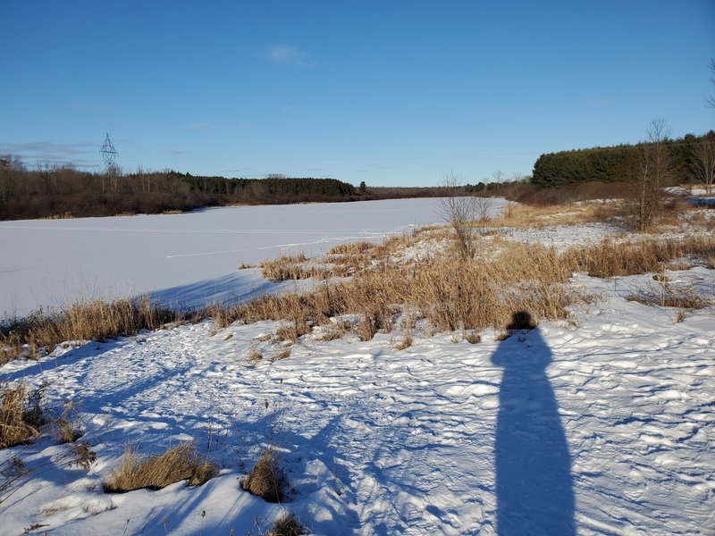 Frozen reservoir at sunset