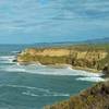 Sandstone cliffs drop to the Pacific Ocean near Half Moon Bay, seen from the bluffs of Cowell-Purisima Trail.