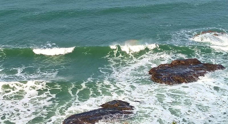 Waves crashing on rocks far below Cowell-Purisima Trail.