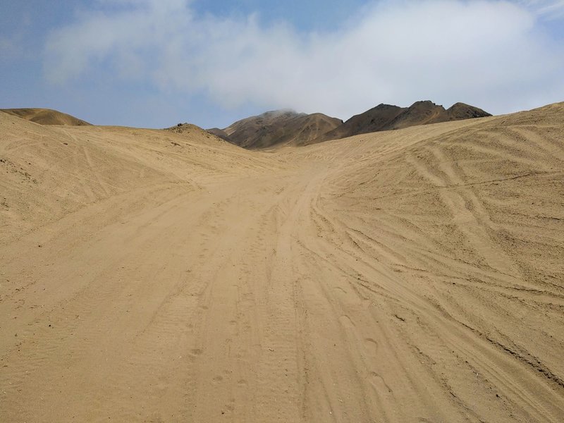 Sandy doubletrack - the summit in the clouds.