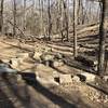 Stone seats around a fire ring.