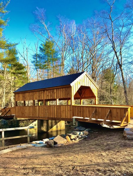 The newly replaced covered bridge over Eightmile River at sunset.