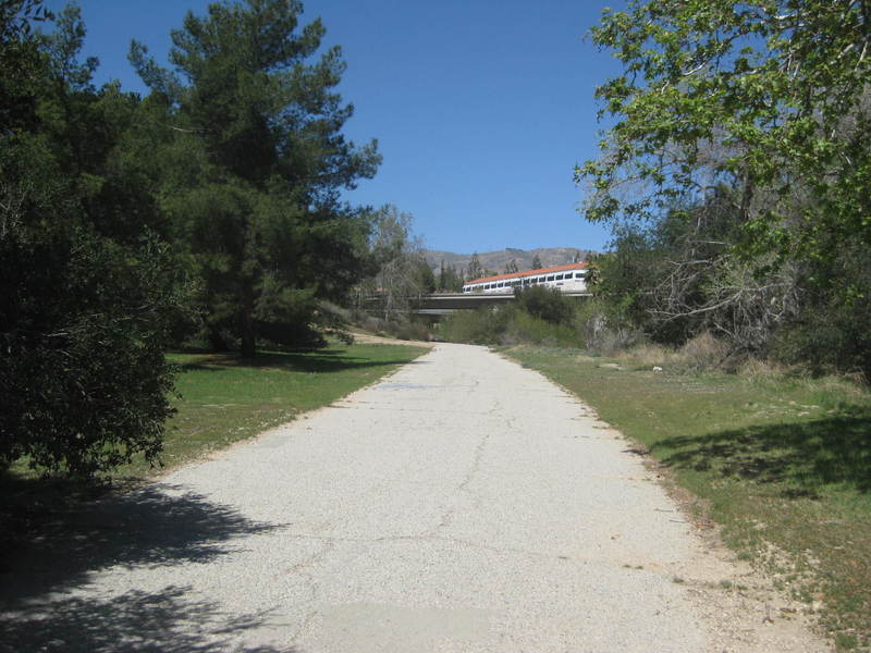 Looking north along the trail, approaching the freeway.