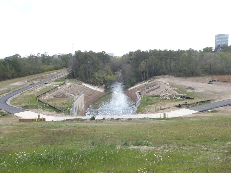 Standing on top of the dike, where the water passes through, looking south at the spillway.