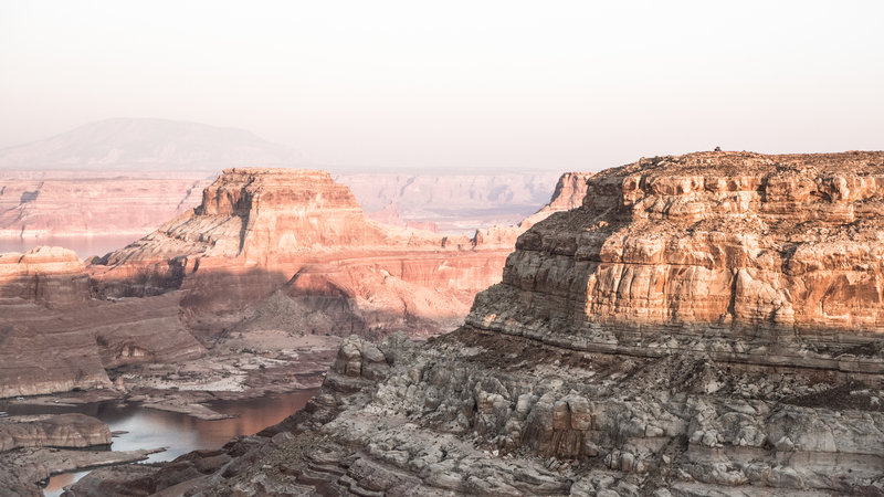 View of a truck parked at Alstrom Point overlooking Gunsight Butte.