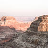 View of a truck parked at Alstrom Point overlooking Gunsight Butte.