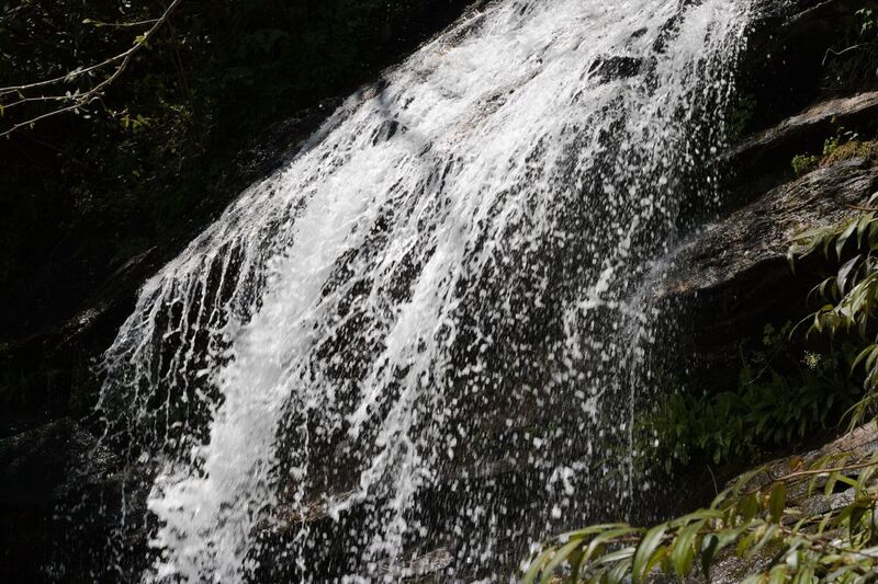 Water falling off rock edge at top.