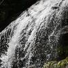 Water falling off rock edge at top.