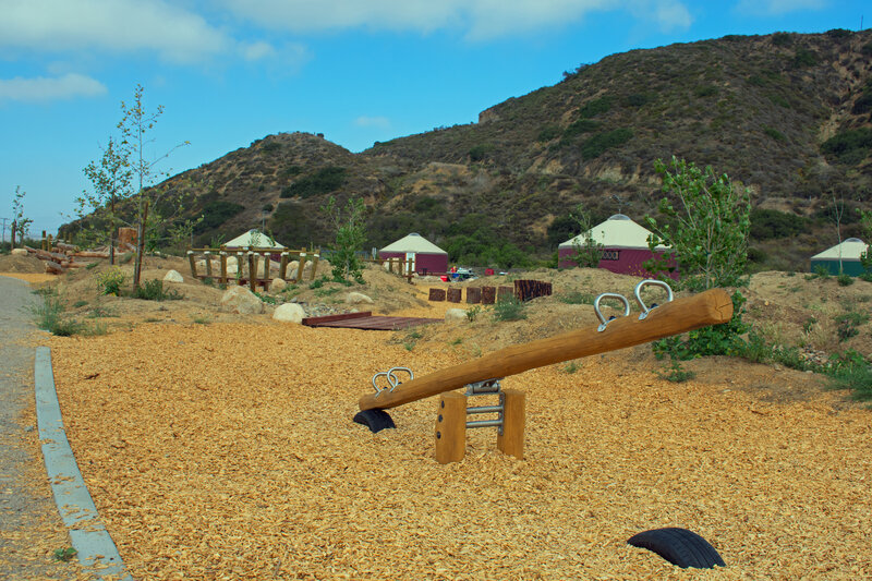 A few to the 16 different playground features made from natural logs. Picture also shows yurts that sleep from 6 to 10 people.