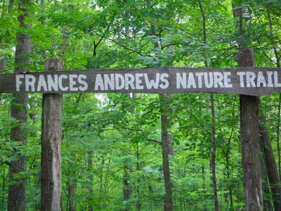 Trail sign welcomes people to start on the Frances Andrews trail.